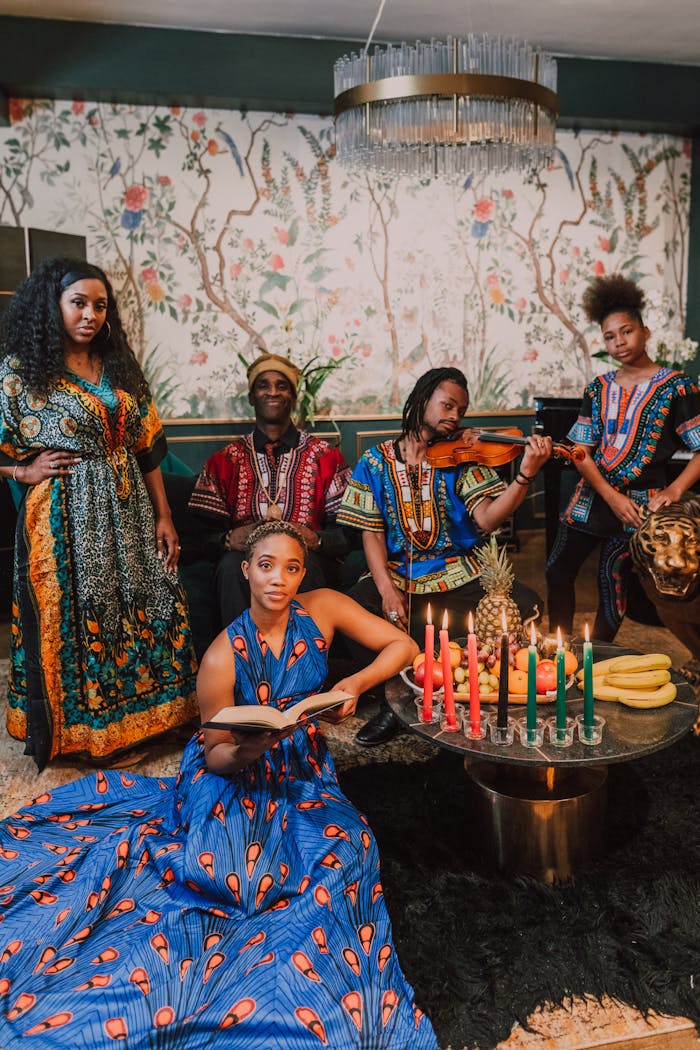 why-choose-us Diverse group celebrating Kwanzaa with traditional clothing and vibrant Kinara candles.